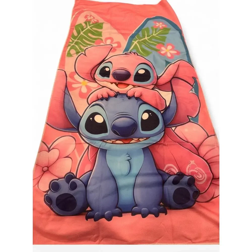 Stitch & Angel beach towel Stitch and Angel with tropical leaves and flowers